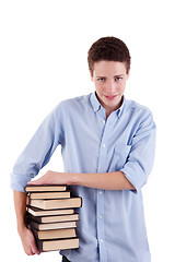 Image showing young and beautiful boy, with books on the hands