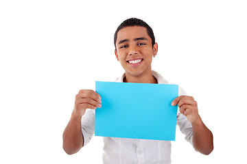 Image showing young latin man, with blue  card in hand, smiling