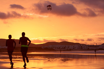 Image showing orange sunset in playa Famara, Lanzarote 