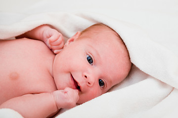 Image showing baby after bath in towel. soft focus 