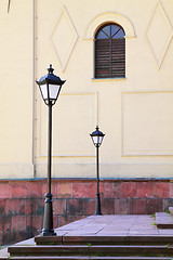 Image showing Two street lamps and window