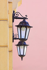 Image showing Two lamps on a wall