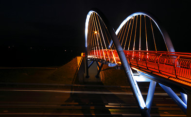 Image showing Pedestrian bridge over road at night