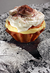 Image showing Muffin with pudding filling and whipped cream