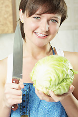 Image showing Woman with cabbage and knife