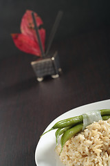 Image showing Brown rice with green bean's pods