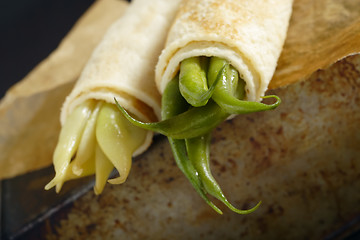 Image showing Pancakes wrapped bean's pods