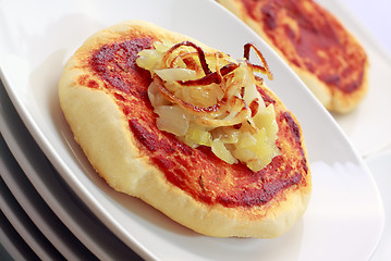 Image showing Simple small pizza (pizzette) with onion