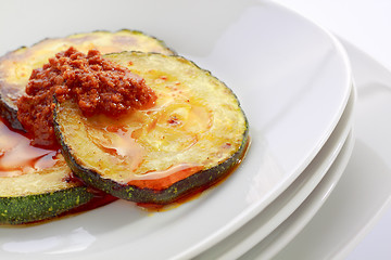 Image showing Fried slices of courgette with sauce