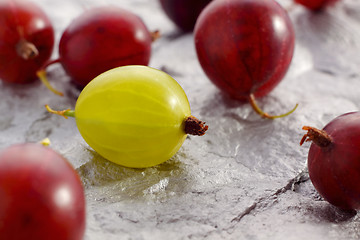 Image showing Yellow and red gooseberries