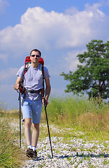 Image showing Walking hiker on stony path