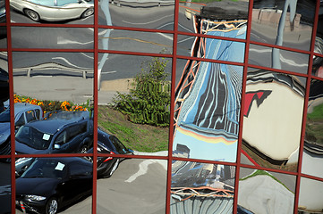 Image showing Distorted Reflection of Cars and Buildings