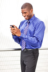 Image showing Black businesswoman texting