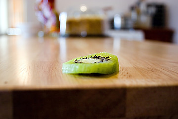 Image showing Sliced Kiwi on the Kitchen Table