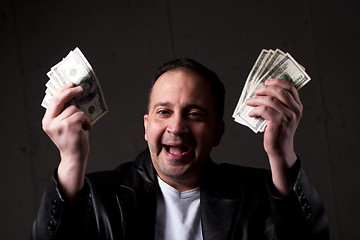 Image showing Man Holding Out Money