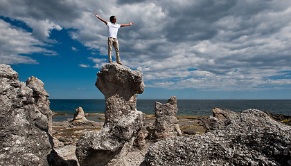 Image showing Boy with arms rasied