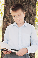 Image showing Cute boy with book