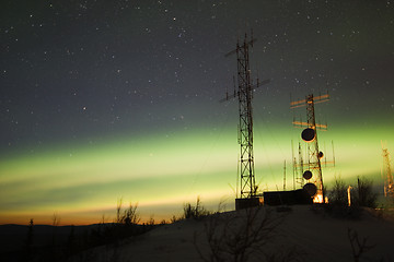 Image showing Aurora Borealis and twilight over antenna complex