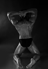 Image showing  Dramatic image of a beautifully sculpted bodybuilder