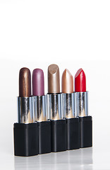 Image showing multicolored lipsticks isolated on white