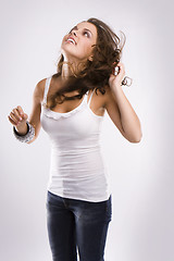 Image showing isolated nice woman on jeans and white tanktop