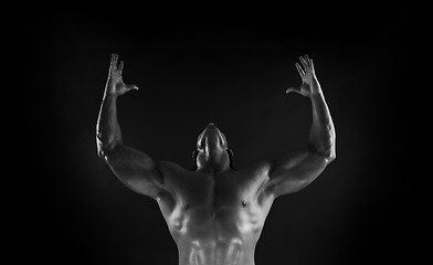 Image showing  Dramatic image of a beautifully sculpted bodybuilder