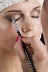 Image showing Woman having her makeup applied