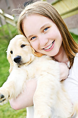 Image showing Girl with puppy