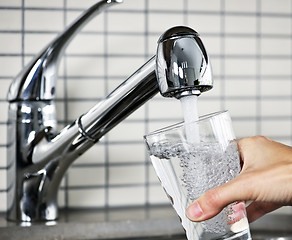 Image showing Filling glass of tap water