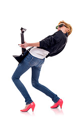 Image showing back picture of a woman guitarist