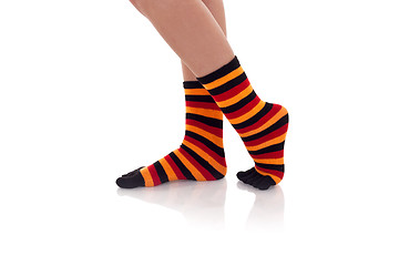 Image showing woman legs in strip socks