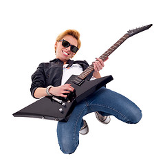 Image showing woman guitarist playing on her knees