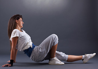 Image showing Sporty female sitting