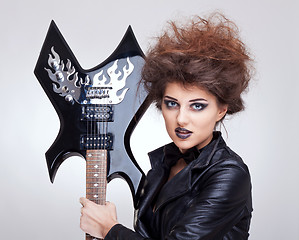 Image showing woman holding an electric guitar