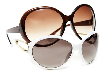 Image showing Two sunglasseses white and brown