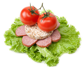 Image showing Sandwich with sausage, tomatoes and salad