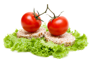 Image showing Two ripe tomatoes and small loaf of bread