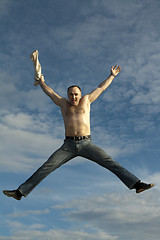 Image showing Man jumps on background sky