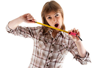 Image showing Young beautiful girl with tape measure