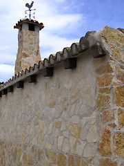 Image showing stone chimney with weathervane