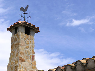 Image showing stone chimney with weathervane