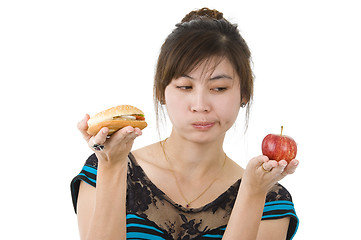 Image showing woman with hamburger and apple