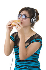 Image showing  woman with hamburger, sunglasses and head phones