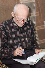 Image showing Senior man working at home