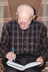 Image showing Senior man working with papers