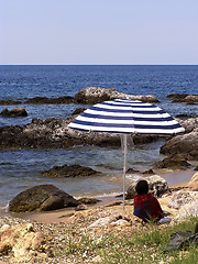 Image showing Under Umbrella