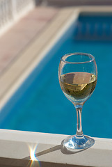 Image showing White wine poolside