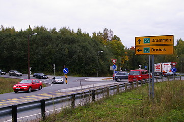 Image showing a roundabout junction with heavy traffic