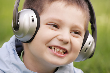 Image showing Portrait of smiling boy in headphones