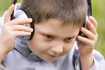 Image showing Portrait of serene boy in headphones